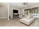 Open living room with L-shaped sofa and view of backyard at 222 Emmy Cv, Oviedo, FL 32765