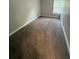 Cozy carpeted bedroom with a window and closet at 6003 Village Cir # Ge, Orlando, FL 32822