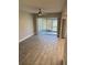 Bright living room with tile floor and sliding glass doors to patio at 6003 Village Cir # Ge, Orlando, FL 32822