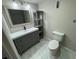 Modern bathroom with gray vanity, marble flooring, and a shower/tub combo at 6003 Village Cir # Ge, Orlando, FL 32822