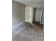 Bright bedroom with neutral walls and carpeted floors at 6003 Village Cir # Ge, Orlando, FL 32822