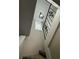 Carpeted staircase with metal railing leading to upper level at 6003 Village Cir # Ge, Orlando, FL 32822