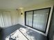 Spacious screened porch with sliding glass doors and storage closet at 6003 Village Cir # Ge, Orlando, FL 32822