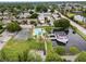 Aerial view showing tennis courts, pool, and boat house at 6003 Village Cir # Ge, Orlando, FL 32822