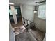 Carpeted staircase with metal railing and access to bedrooms at 6003 Village Cir # Ge, Orlando, FL 32822