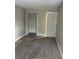 Well-lit bedroom with neutral walls and carpet at 6003 Village Cir # Ge, Orlando, FL 32822