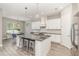 Spacious kitchen with island seating and stainless steel appliances at 222 Emmy Cv, Oviedo, FL 32765