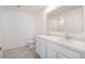 Double vanity bathroom with white cabinets and gray tile flooring at 15031 Sw 28Th Terrace Rd, Ocala, FL 34473