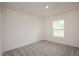Simple bedroom with carpeted floor and window with blinds at 15031 Sw 28Th Terrace Rd, Ocala, FL 34473