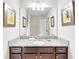 Bathroom with single vanity, granite countertop, and mirror at 1586 Lima Ave, Kissimmee, FL 34747
