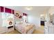 Bedroom with queen bed, paisley bedding, and ensuite bathroom at 1586 Lima Ave, Kissimmee, FL 34747