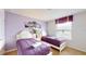 Bedroom with two twin beds and purple bedding at 1586 Lima Ave, Kissimmee, FL 34747