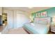 King bedroom with teal walls and access to the game room at 1586 Lima Ave, Kissimmee, FL 34747