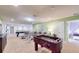 Spacious game room with foosball and views to other rooms at 1586 Lima Ave, Kissimmee, FL 34747