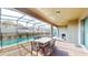 Pool area with patio furniture and screened enclosure at 1586 Lima Ave, Kissimmee, FL 34747