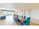 Large dining room with seating for twelve and modern artwork at 1586 Lima Ave, Kissimmee, FL 34747