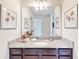Bathroom with single vanity, granite countertop, and mirror at 1586 Lima Ave, Kissimmee, FL 34747