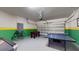 Game room with foosball table, ping pong, and bar stools at 1586 Lima Ave, Kissimmee, FL 34747