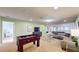 Game room featuring foosball table and sectional sofa at 1586 Lima Ave, Kissimmee, FL 34747