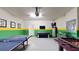 Game room featuring air hockey, ping pong, and TV at 1586 Lima Ave, Kissimmee, FL 34747