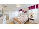 Bedroom with queen bed, paisley bedding, and ensuite bathroom at 1586 Lima Ave, Kissimmee, FL 34747