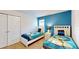 Minion themed bedroom with twin beds and blue walls at 1586 Lima Ave, Kissimmee, FL 34747