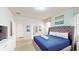 Bright bedroom with king-size bed and access to a shared bathroom at 1586 Lima Ave, Kissimmee, FL 34747