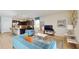 Open living space with teal sofas and a view of the kitchen at 1586 Lima Ave, Kissimmee, FL 34747