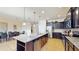 Modern kitchen with stainless steel appliances and granite countertops at 1586 Lima Ave, Kissimmee, FL 34747
