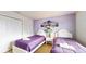Bedroom with two twin beds and purple bedding at 1586 Lima Ave, Kissimmee, FL 34747