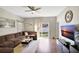 Open living space with hardwood floors, sectional sofa, and access to backyard at 2524 Dover Glen Cir, Orlando, FL 32828