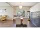 Bright dining room with a rustic wooden table and chandelier at 2524 Dover Glen Cir, Orlando, FL 32828