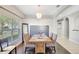 Bright dining room with a rustic wooden table and chandelier at 2524 Dover Glen Cir, Orlando, FL 32828
