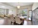 Bright dining room with a rustic wooden table and chandelier at 2524 Dover Glen Cir, Orlando, FL 32828