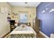 bedroom with a playful wall and built-in desk at 2524 Dover Glen Cir, Orlando, FL 32828