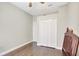 Well-lit bedroom featuring wood floors and a double door closet at 2524 Dover Glen Cir, Orlando, FL 32828