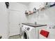 Laundry room with washer, dryer, and extra shelving at 2524 Dover Glen Cir, Orlando, FL 32828