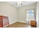 Spacious bedroom with wood floors and a window at 2524 Dover Glen Cir, Orlando, FL 32828