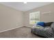 Bedroom with carpet flooring and a daybed at 33 Fisher Run Ter, Ocklawaha, FL 32179