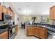 Modern kitchen featuring wood cabinets and a breakfast nook at 33 Fisher Run Ter, Ocklawaha, FL 32179