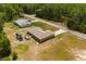 Aerial view showing house, yard, and surrounding neighborhood at 33 Fisher Run Ter, Ocklawaha, FL 32179