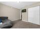 Spacious bedroom with large closet and TV at 33 Fisher Run Ter, Ocklawaha, FL 32179