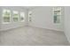 Bright bedroom with wood-look floors and multiple windows at 3860 Rose Malllow Dr, Kissimmee, FL 34746