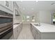 Modern kitchen with stainless steel appliances and white cabinets at 3860 Rose Malllow Dr, Kissimmee, FL 34746