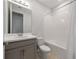 Bathroom with tub, shower, and vanity with storage at 3860 Rose Malllow Dr, Kissimmee, FL 34746