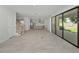 Open living space with wood-look floors and a view into the kitchen at 3860 Rose Malllow Dr, Kissimmee, FL 34746