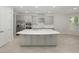 Modern kitchen with gray island and stainless steel appliances at 3860 Rose Malllow Dr, Kissimmee, FL 34746