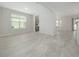 Dining room with tile floors and view into kitchen at 3860 Rose Malllow Dr, Kissimmee, FL 34746