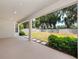 Covered patio overlooking a spacious backyard with landscaping at 3860 Rose Malllow Dr, Kissimmee, FL 34746