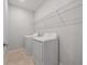 Laundry room with washer, dryer, and shelving at 3860 Rose Malllow Dr, Kissimmee, FL 34746